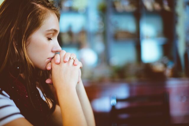 upset woman with closed eyes