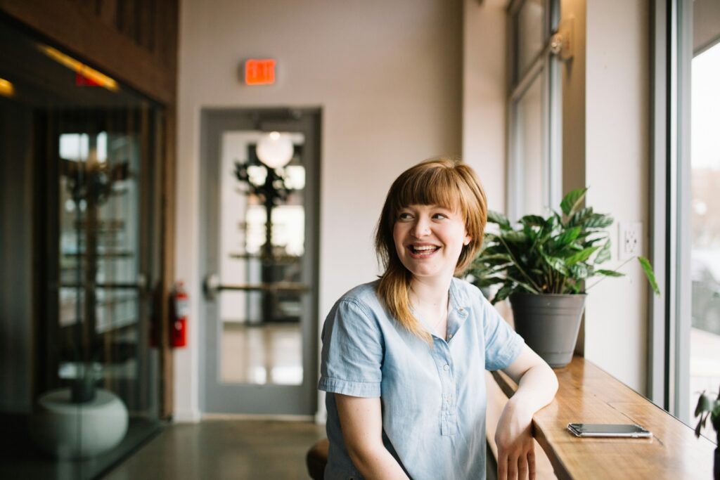 smiling woman sitting in office