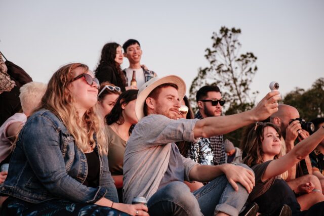 a group of friends taking selfie outside