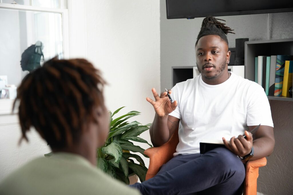 man and owman talking in chairs