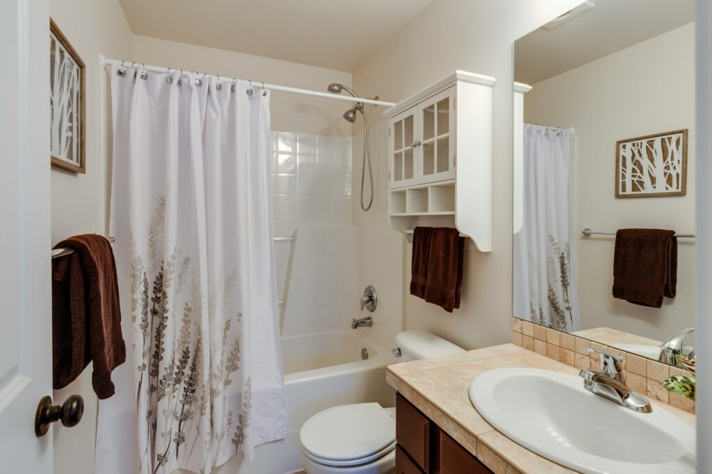 bathroom with pulled shower curtain