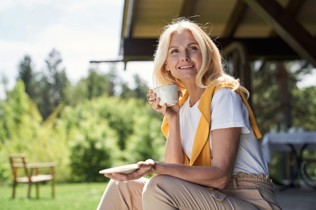 middle aged woman sitting outside