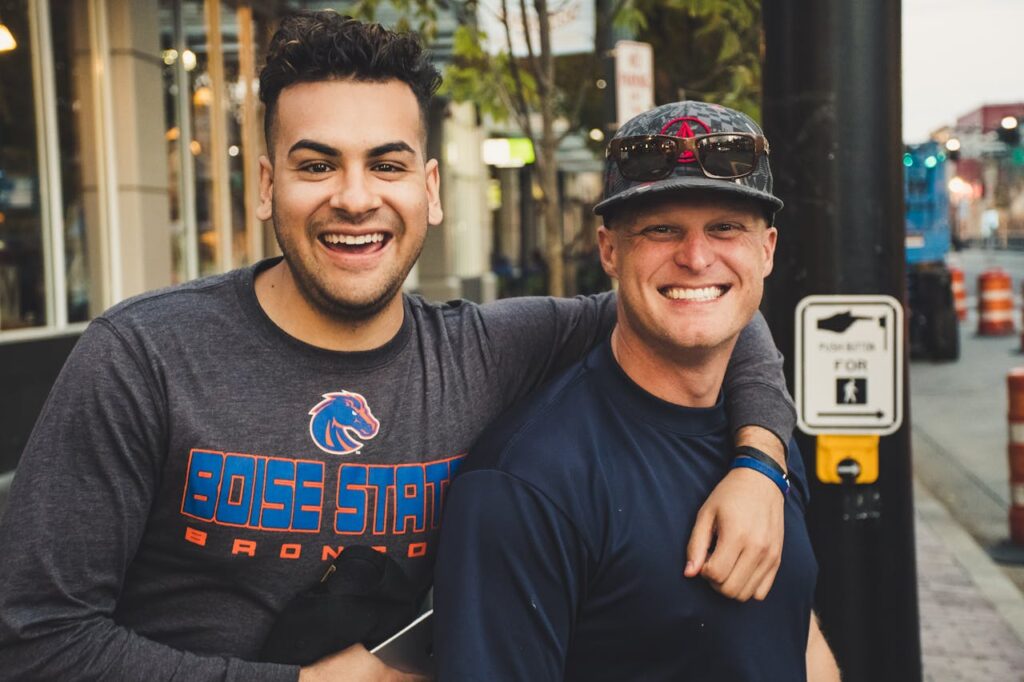 two male friends smiling